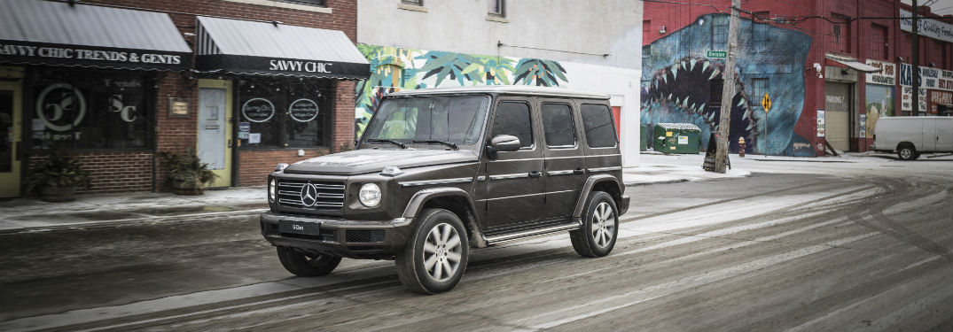 2019 mercedes-benz g-class driving on downtown street