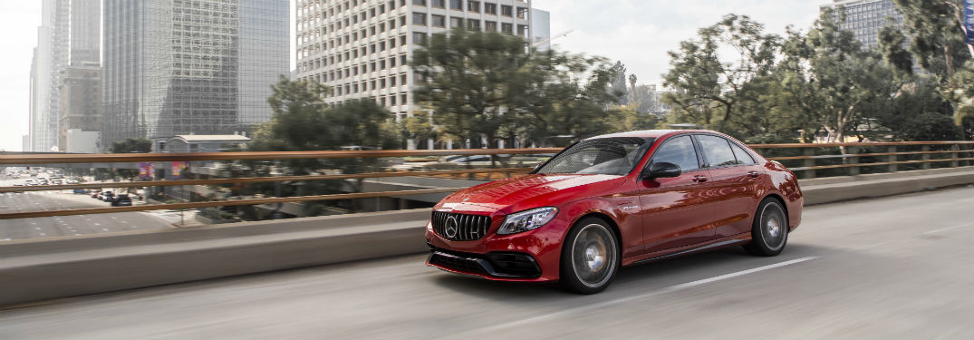 2019 MB C-Class exterior front fasica and drivers side going fast on city highway