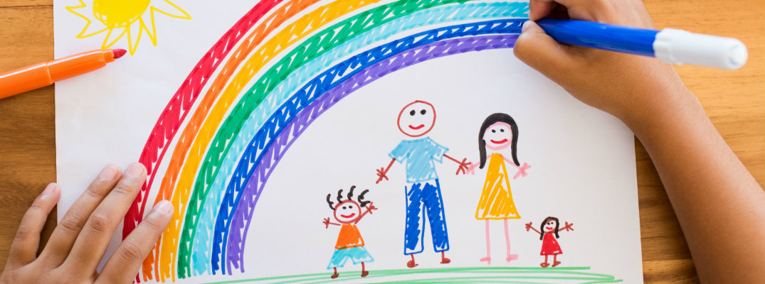 Marker drawing of a family under a rainbow