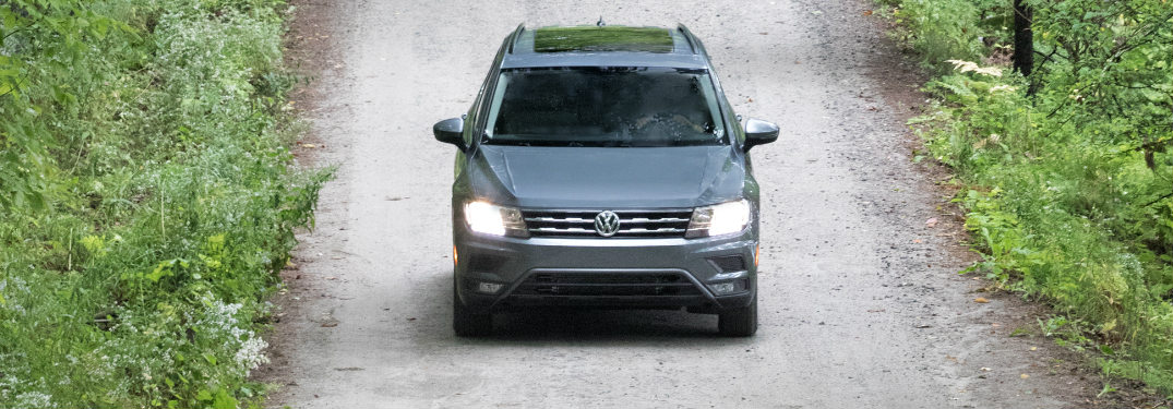 2018 Volkswagen Tiguan driving on a path in the woods