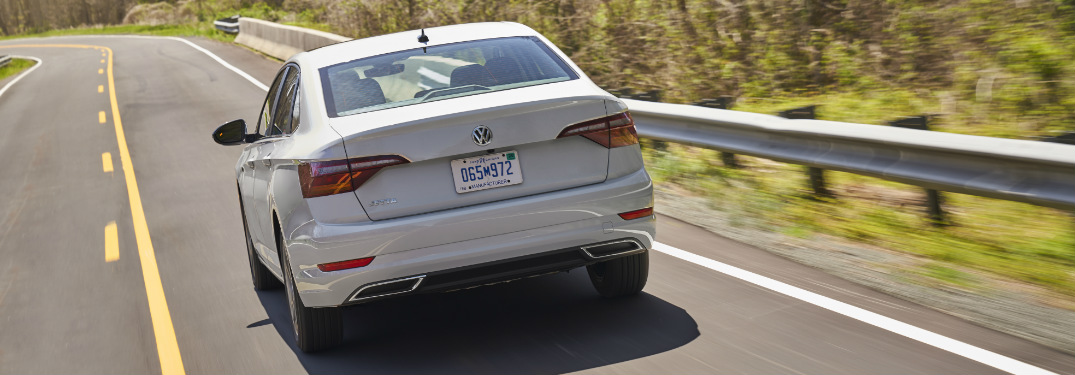 2019 Volkswagen Jetta driving down an empty country highway