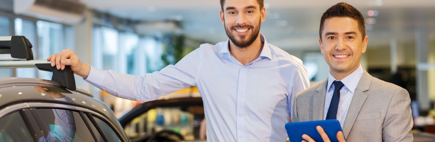 Two salesmen in a Ford dealership