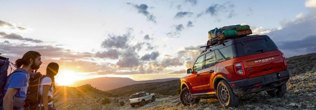 A red Ford Bronco Sport during the sunset.