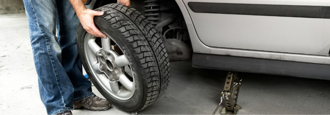 Technician checking a tire