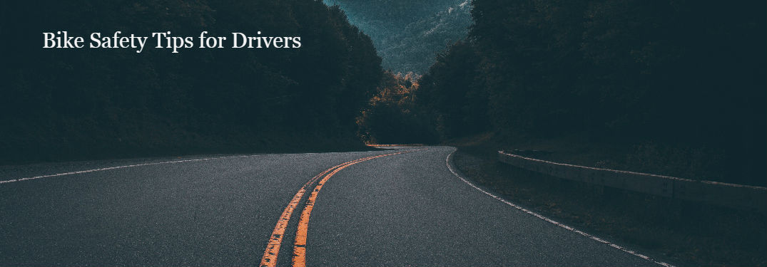 bike safety tips for drivers, curved road at night