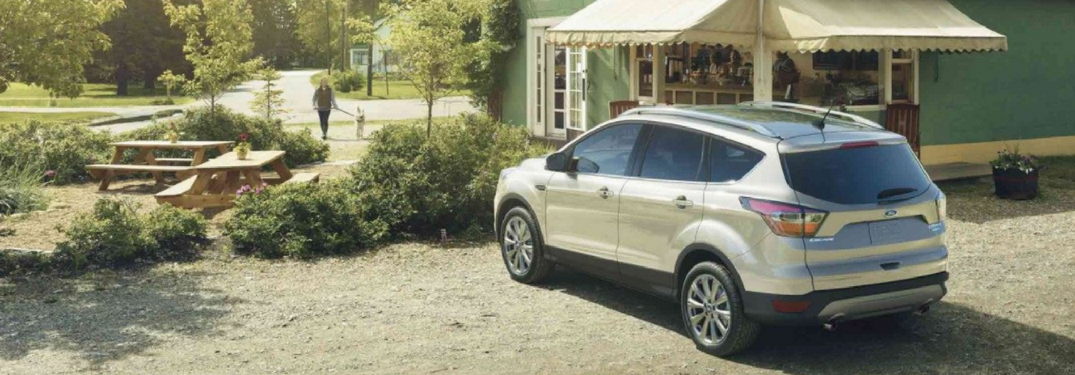 2018 Ford Escape parked in the country by a shop