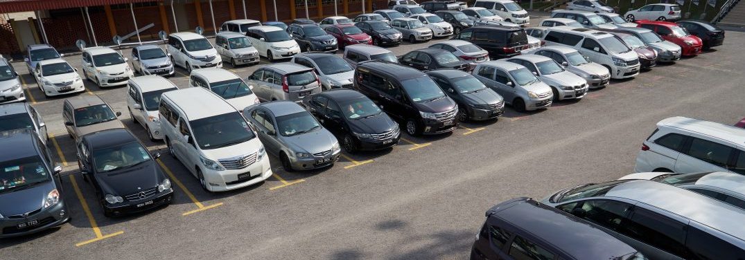car lot with various used vehicles for sale