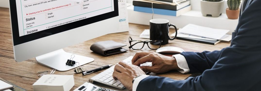 man at computer checking his credit score and he doesn't even have one