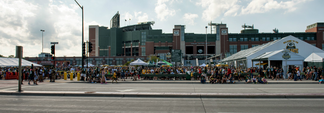 exterior of lambeau field and parking lot with tailgate parties