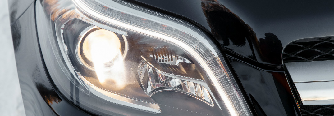 close up of headlight of black car