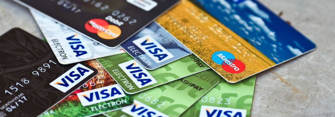 group of various credit cards together in a pile