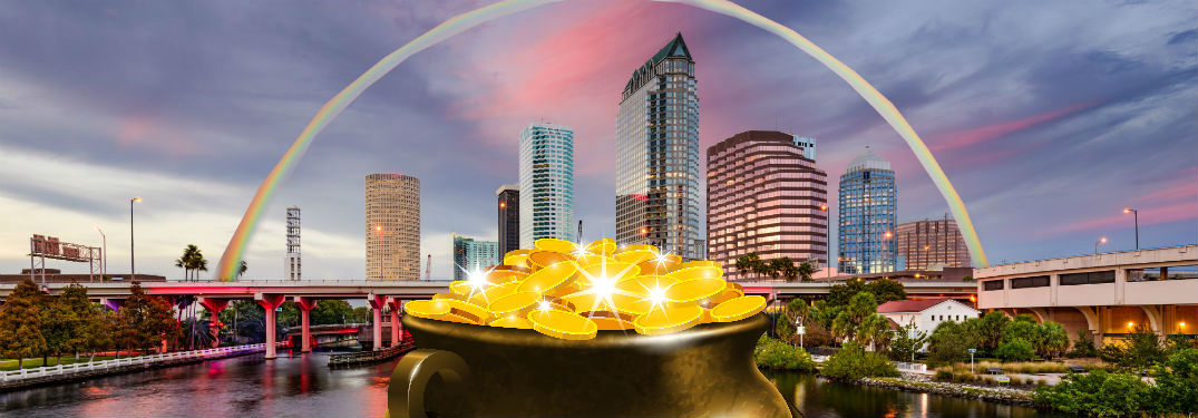 rainbow over tampa skyline with pot of gold in the foreground