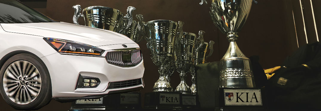 2018 kia cadenza in white overlaid on trophies