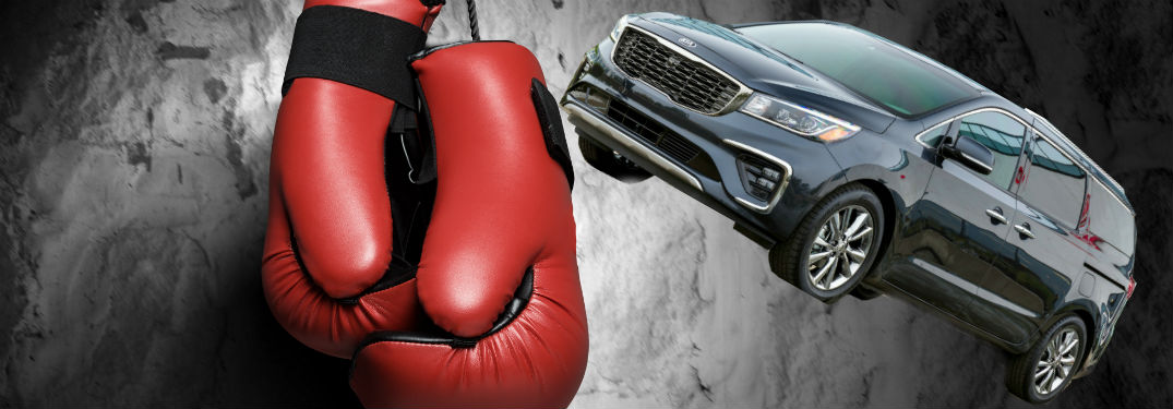 boxing gloves with kia sedona on photo