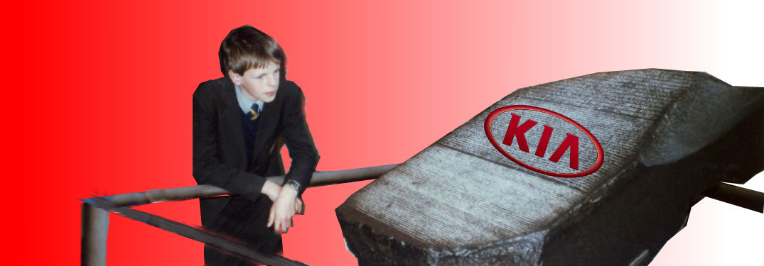 kid staring at Rosetta Stone on display with a kia logo superimposed on a gradient background