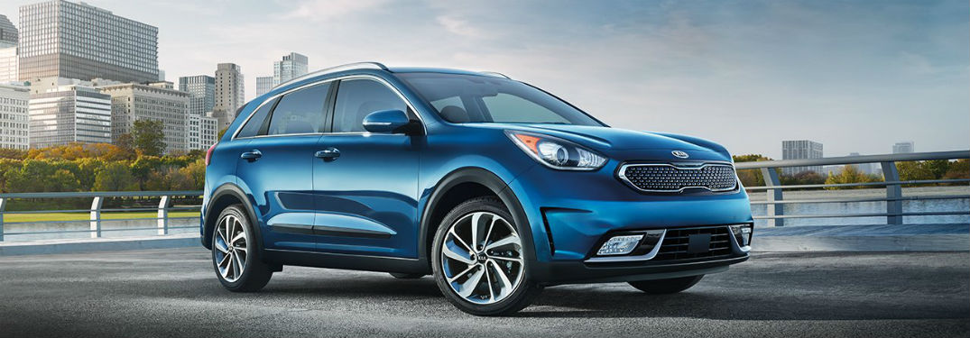 2018 Kia niro in dark blue driving on road