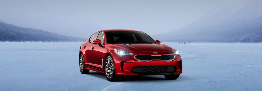 red 2019 kia stinger base on the snow