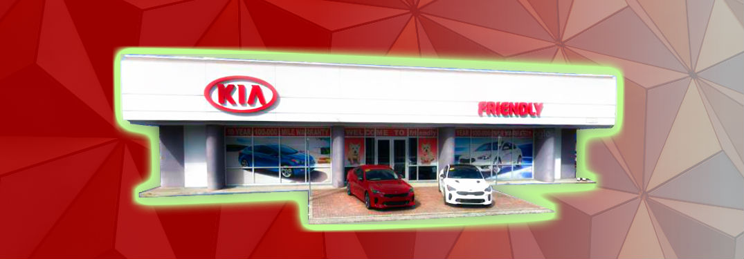 fascia of Friendly Kia against patterned background