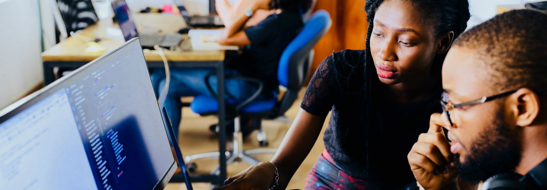 student receiving assistance on computer