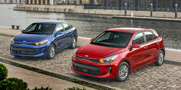 Red 2019 Kia Rio 5-door and blue 2019 Kia Rio