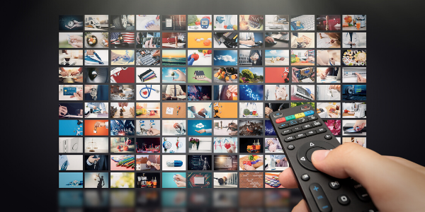 Remote control pointing at arrangement of icons on tv screen