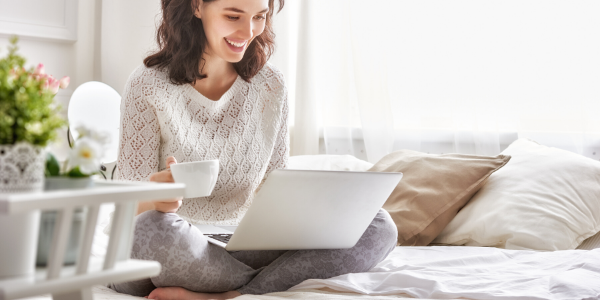 Woman smiling at laptop