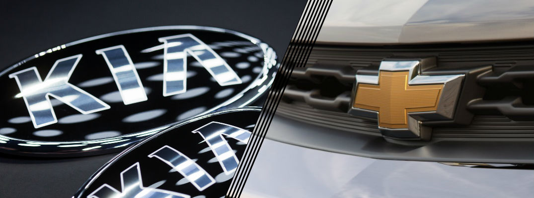 Closeup of Kia and Chevrolet logos