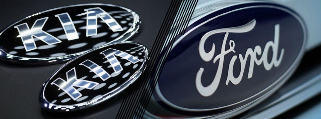Closeup of Kia and Ford emblems