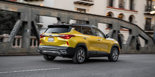 Rear exterior view of yellow 2021 Kia Seltos