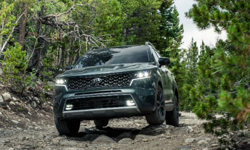 Aruba Green 2021 Kia Sorento X-Line driving through forest