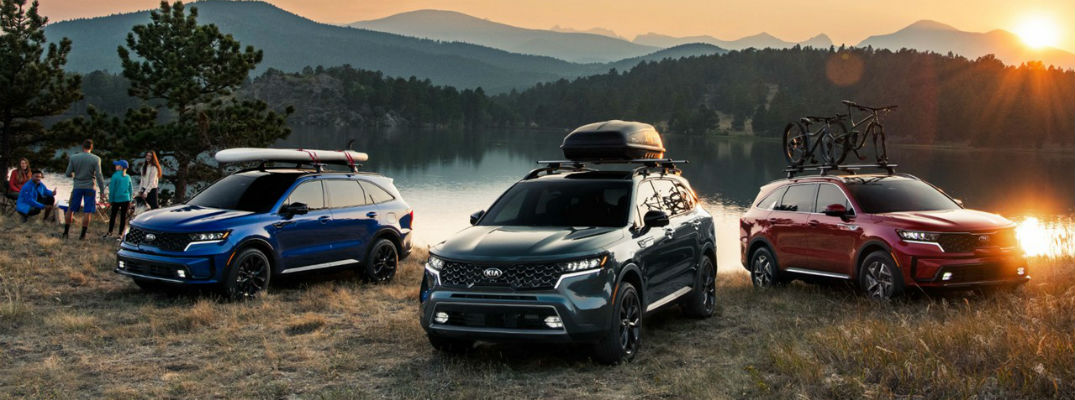Three 2021 Kia Sorento vehicles in front of water