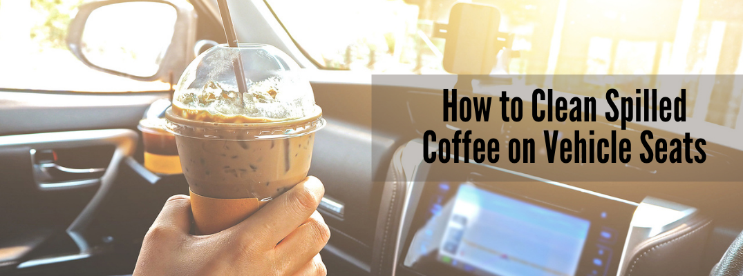 Person holding iced coffee in car with "How to Clean Spilled Coffee on Vehicle Seats" black text