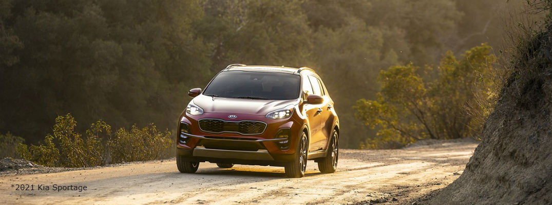 Red 2021 Kia Sportage driving