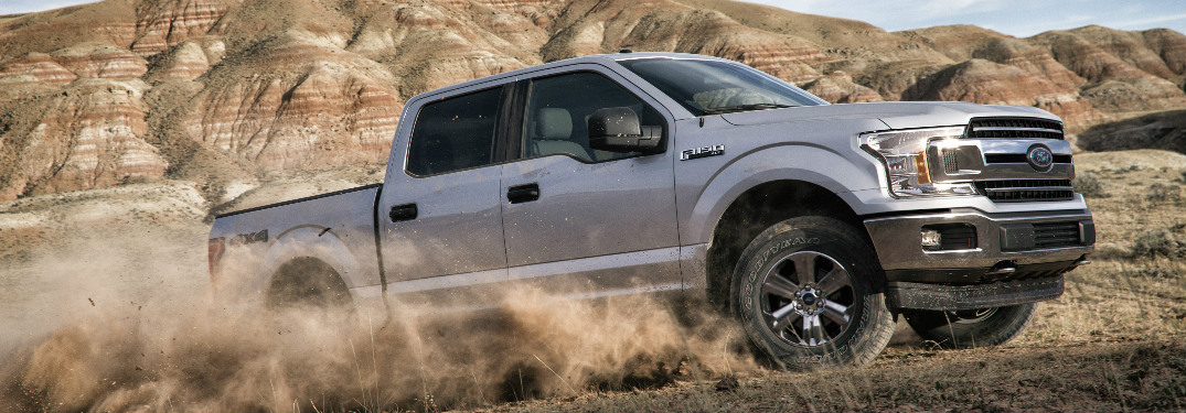 Silver 2018 Ford F-150 Driving Off-Road in a Desert