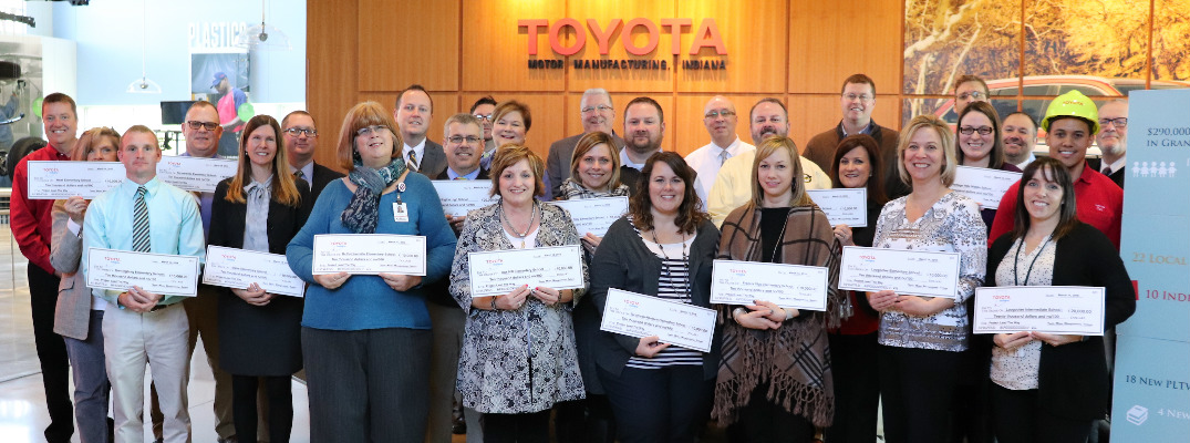 People Holding Ceremonial Check for the STEM Grants from the Toyota USA Foundation