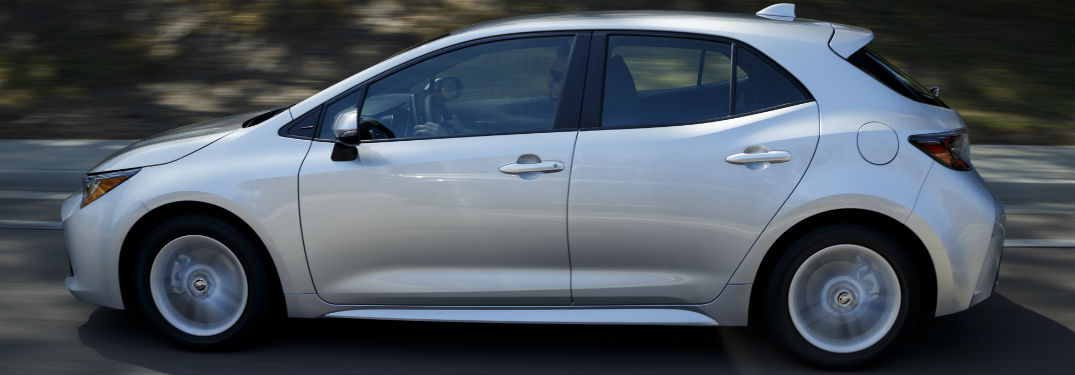 2019 Toyota Corolla Hatchback exterior drivers side profile going fast on road