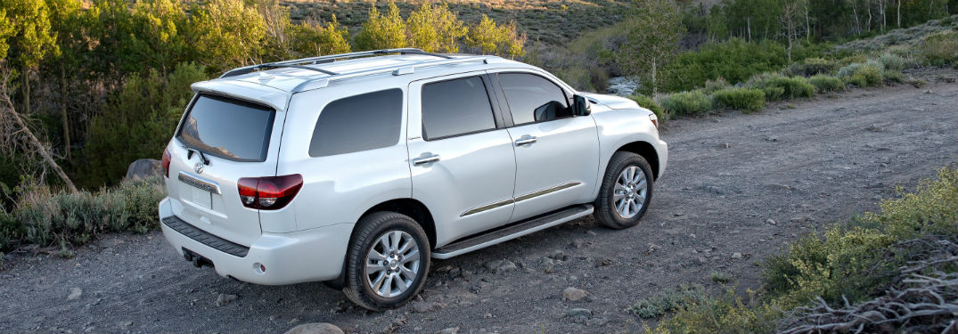 2019 Toyota Sequoia exterior back fascia and passenger side on forest dirt road