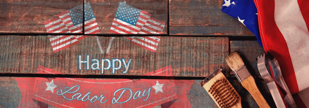 Happy Labor Day text on banner with 3 flags and tools
