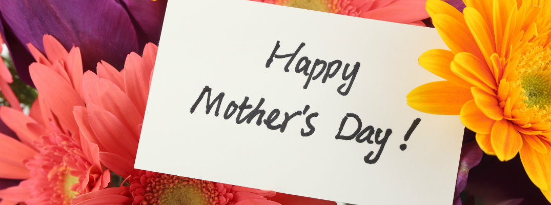 happy mother's day card surrounded by colorful orange, yellow, pink, and purple flowers bouquet