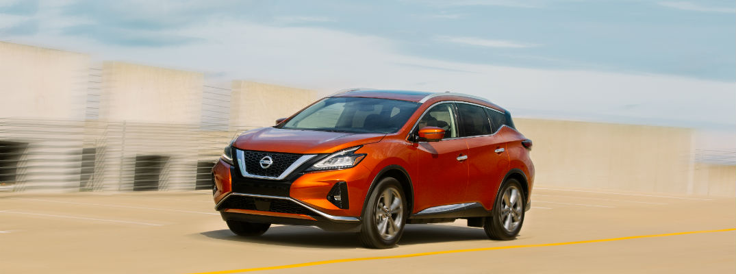 A left profile photo of the 2020 Nissan Murano in motion on the road.