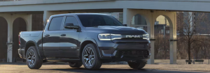 2025 Ram 1500 REV parked in front of a building