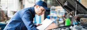 Mechanic inspecting a vehicle