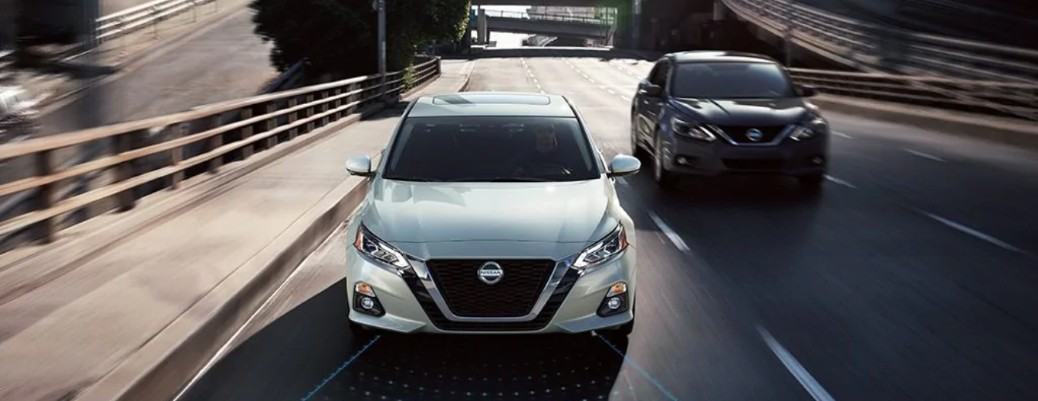 Front view of Nissan Altima models driving on highway