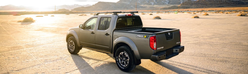 2020 Nissan Frontier driving into the sunset