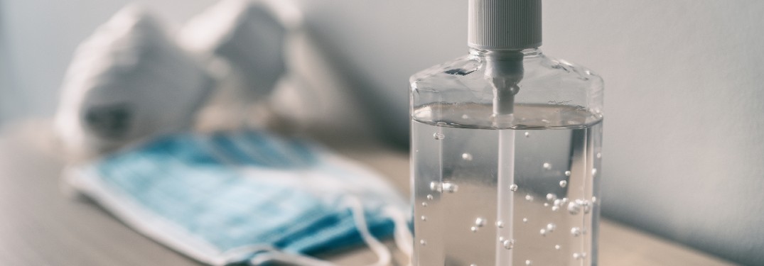 sanitizer and masks on a table