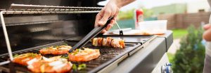 man grilling chicken