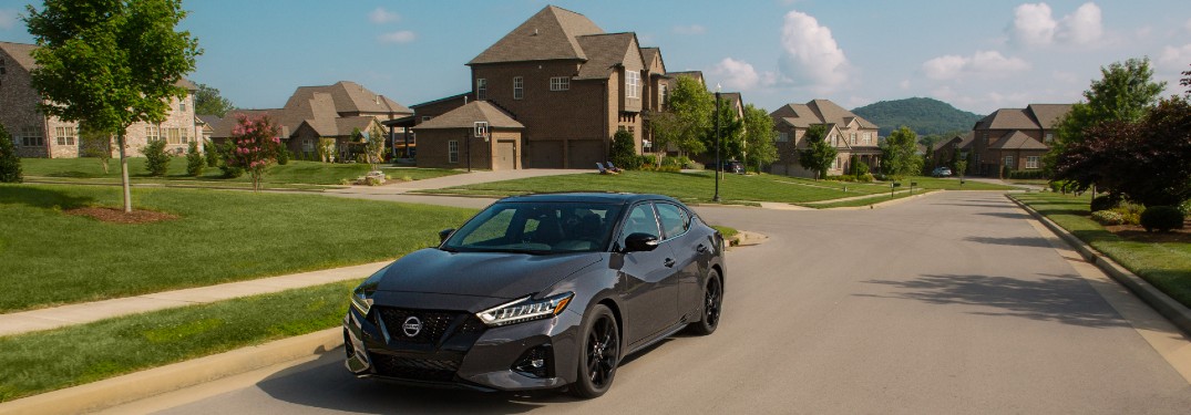 2021 Nissan Maxima with houses in the background