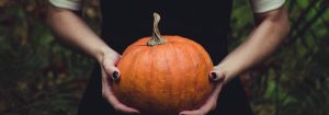 hands holding pumpkin