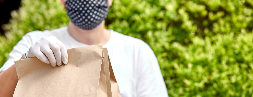 man holding on delivery food