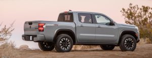 2022 Nissan Frontier gray side view in desert